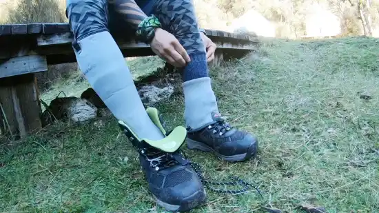 Is it safe to put hand warmers in wet wader boots when Fishing