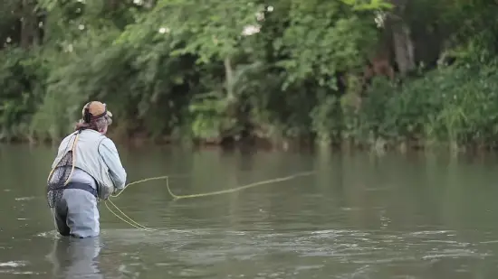 Why do fishermen wear waders